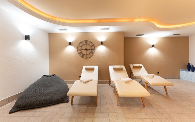 Spa with relaxation loungers and a wellness area.